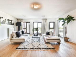 Draperies & Curtains | Window Shutters Los Angeles CA Luxurious draperies creating an elegant atmosphere in a living room.